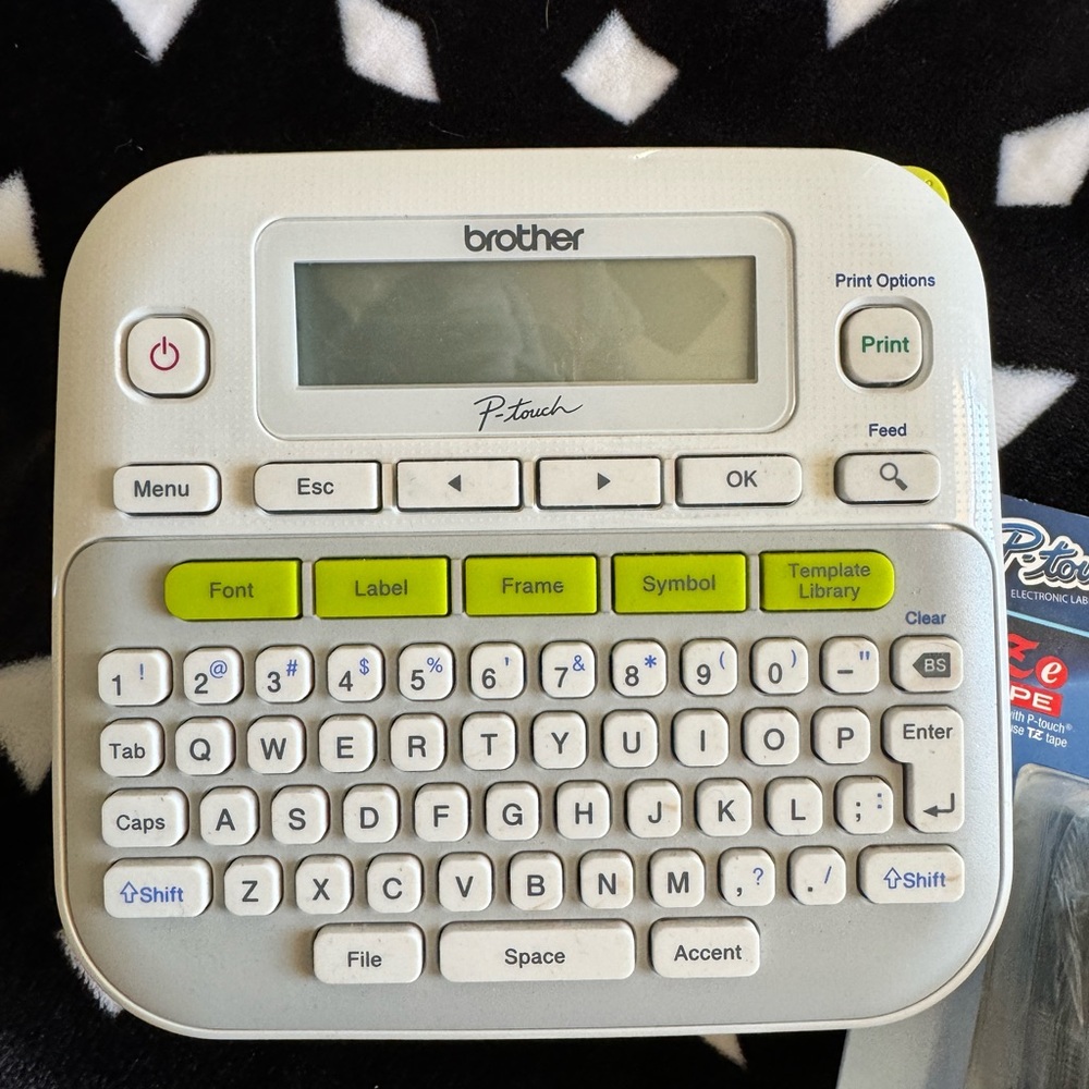 Brother label maker with extra tape packs.